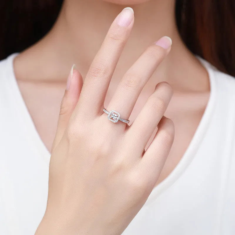 Square hollow 925 sterling silver ring with synthetic zirconia inlay on silver background