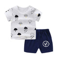 Cotton short sleeve top and shorts set for babies with cartoon elephant print.