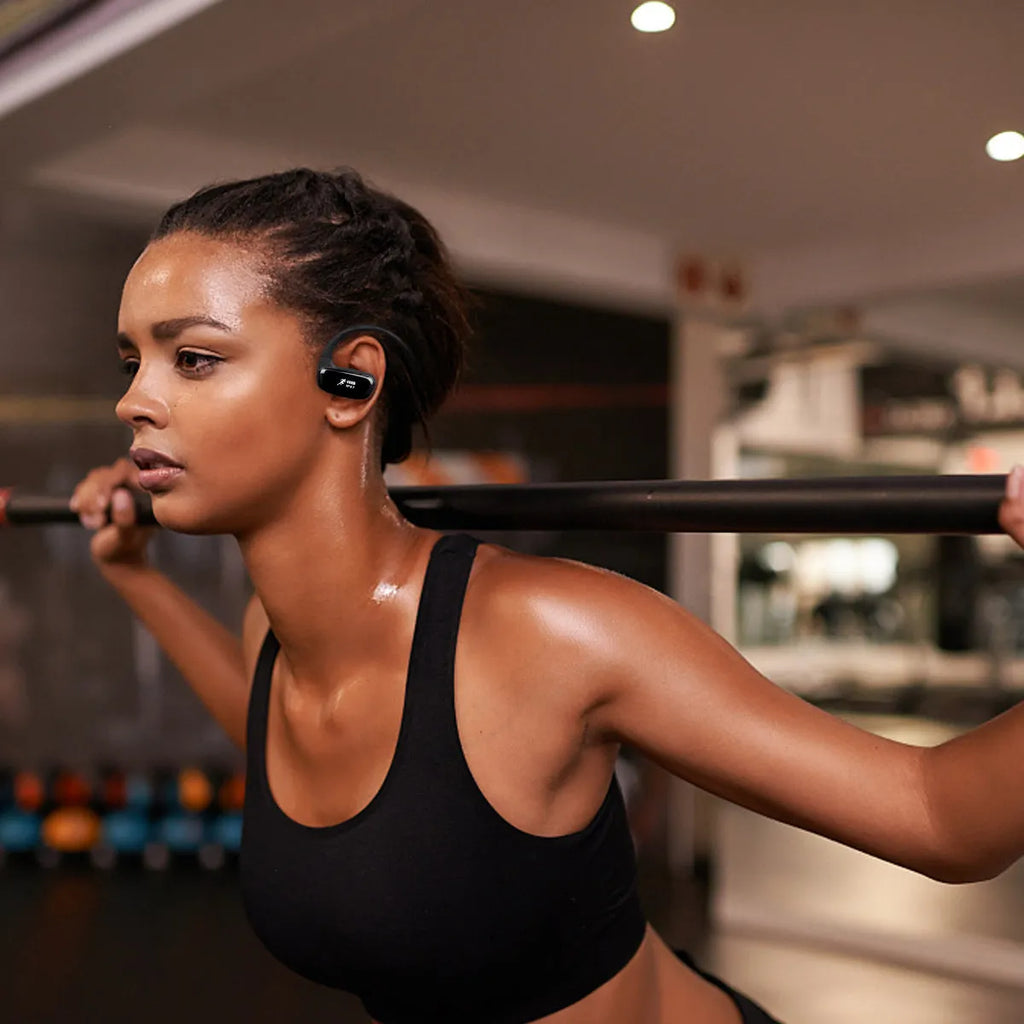 Wireless Bluetooth headset in black with hanging ear design, battery display and bilateral earbuds