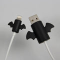 White Angel and black Bat design silicone protective covers for mobile phone charging cables in two sizes.