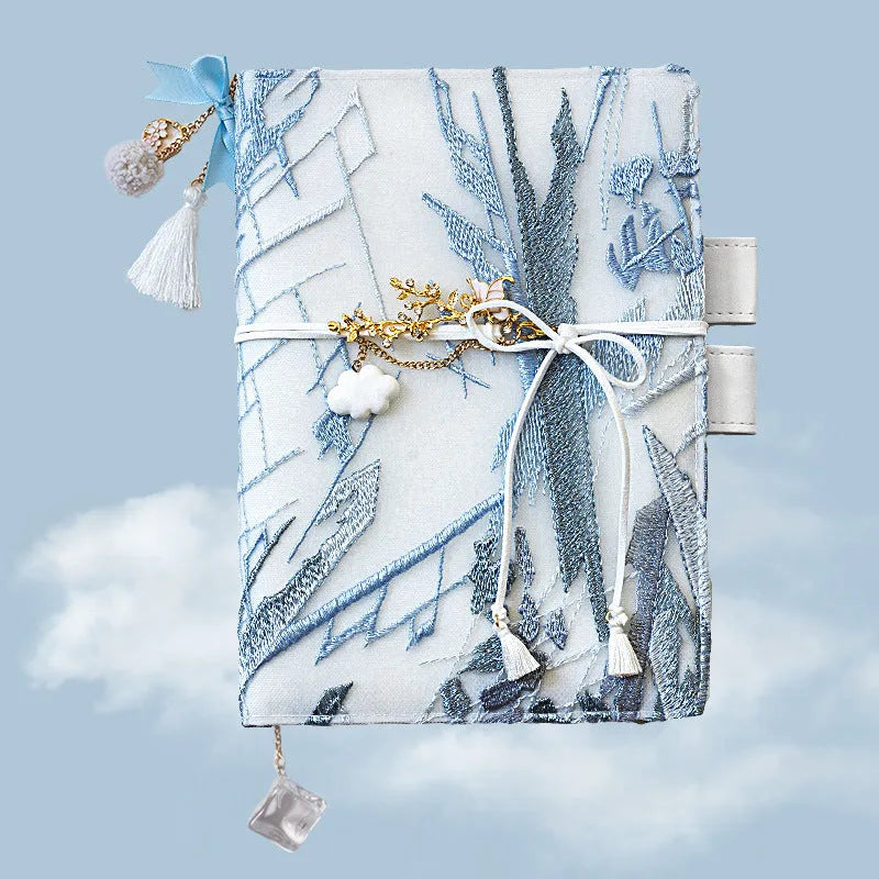 Glacier embroidery pattern fabric notebook with grid pages in A6 and A5 sizes.