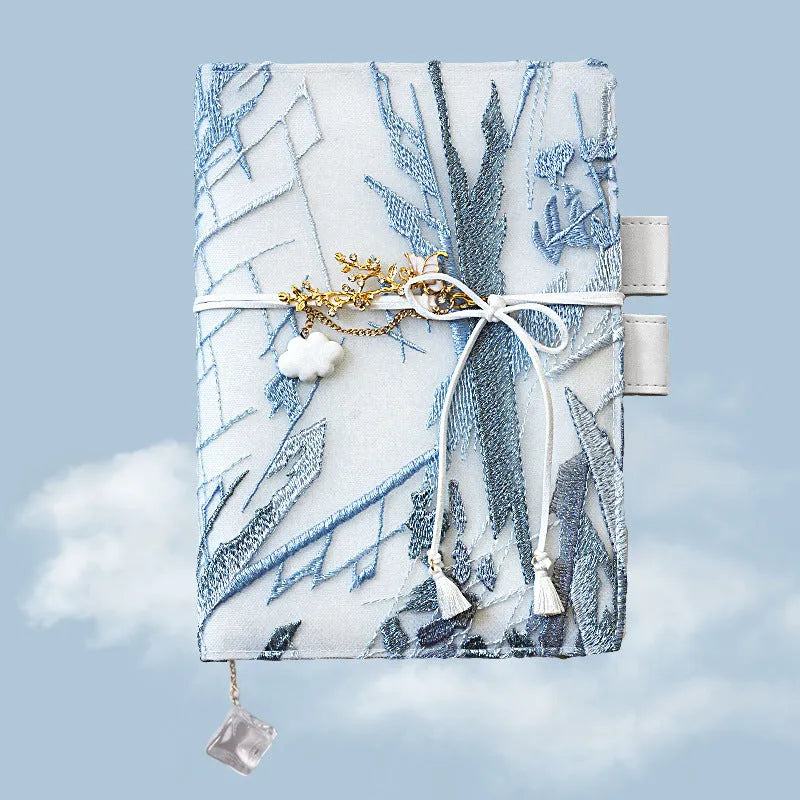 Glacier embroidery pattern fabric notebook with grid pages in A6 and A5 sizes.