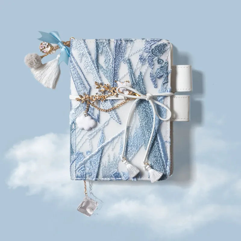 Glacier embroidery pattern fabric notebook with grid pages in A6 and A5 sizes.