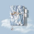 Glacier embroidery pattern fabric notebook with grid pages in A6 and A5 sizes.