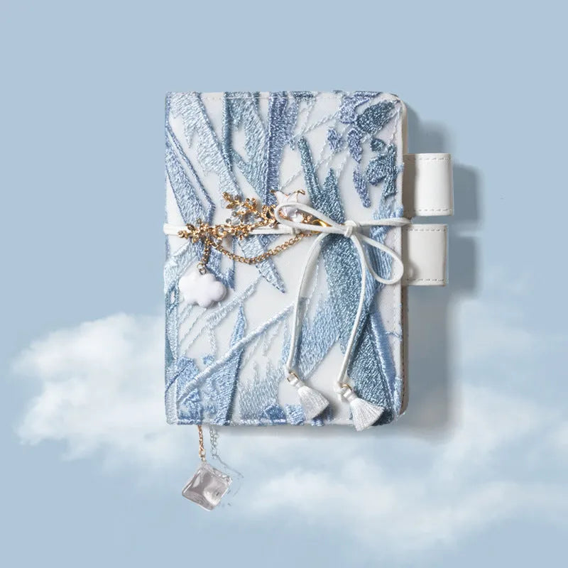 Glacier embroidery pattern fabric notebook with grid pages in A6 and A5 sizes.