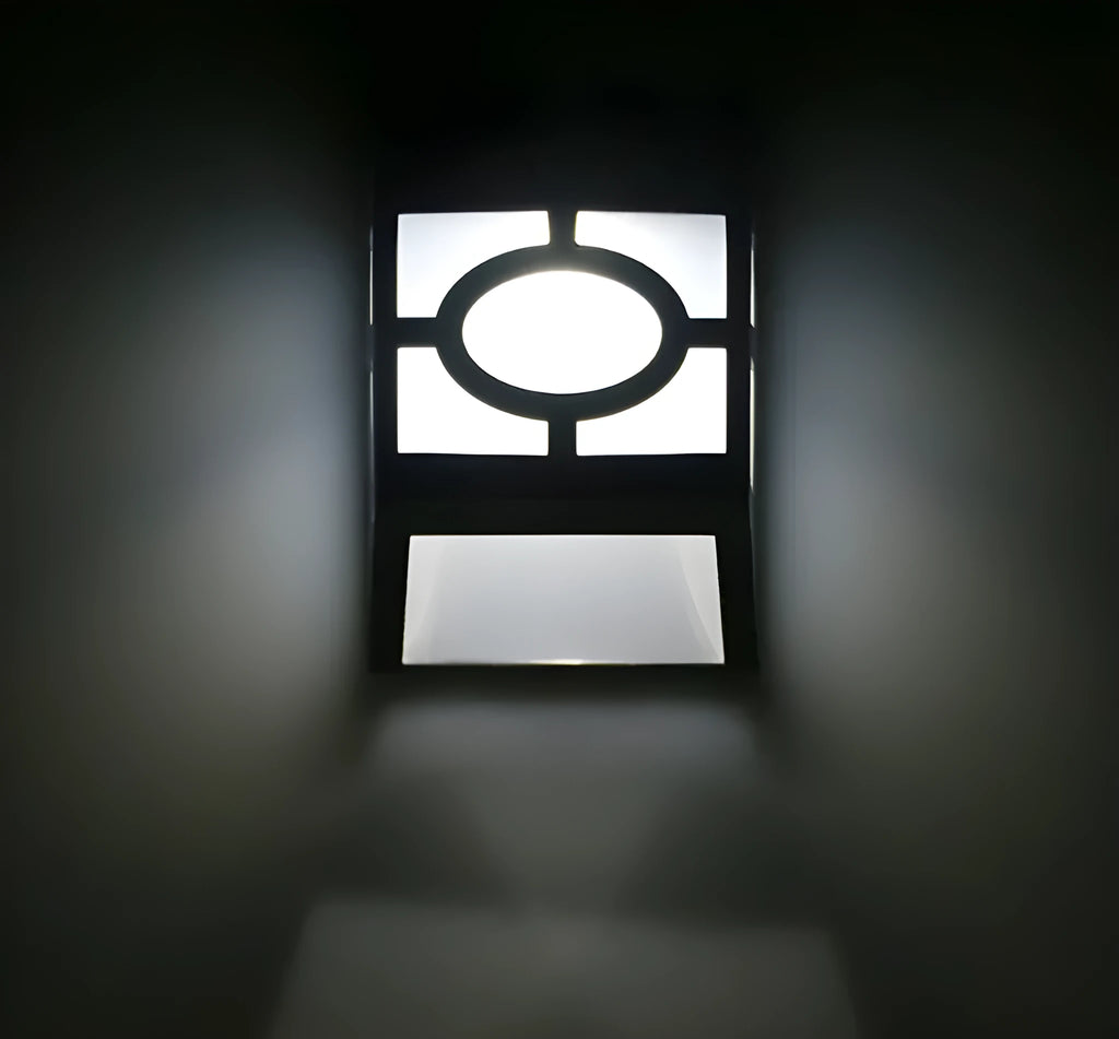 Retro-style white solar wall light with solar panel and two LEDs, shown next to a mounting screw.
