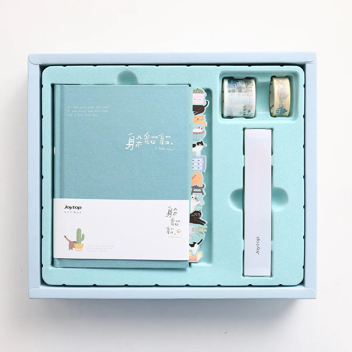 Peekaboo gift box A6 hand ledger notebook with pen in random blue, green, pink, or purple cover.