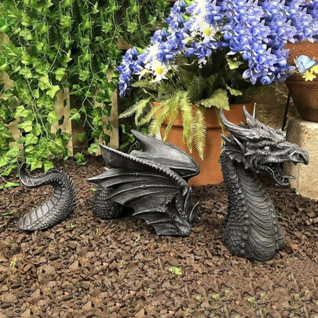 Large gothic dragon garden statue in charcoal gray stone with scales, wings, and tail, outdoor lawn decor