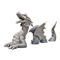 Large gothic dragon garden statue in charcoal gray stone with scales, wings, and tail, outdoor lawn decor