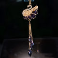 Double-sided crystal swan car pendant in blue metal and rhinestone, hanging from rearview mirror