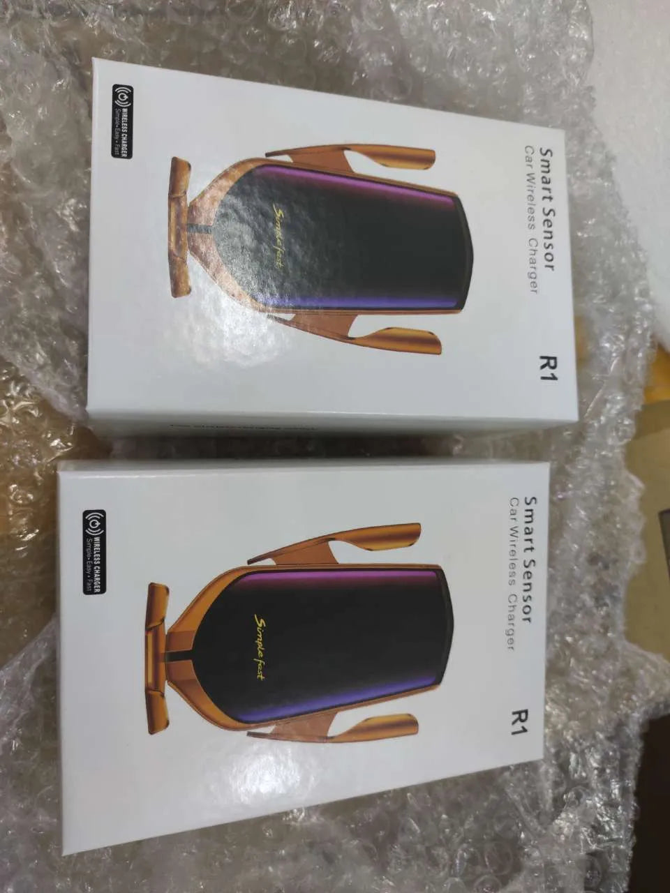 Magic Clip R1 automatic car phone holder wireless charger in gold or silver on dashboard