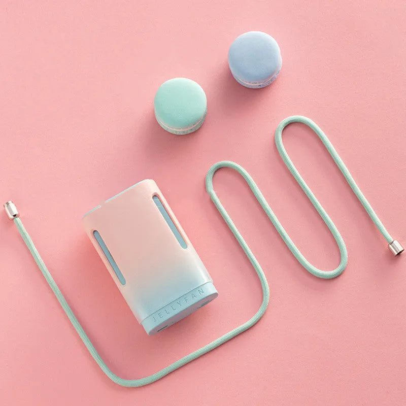 Jelly USB rechargeable mini fan shown in mint peach colour, featuring a neck strap and compact design.