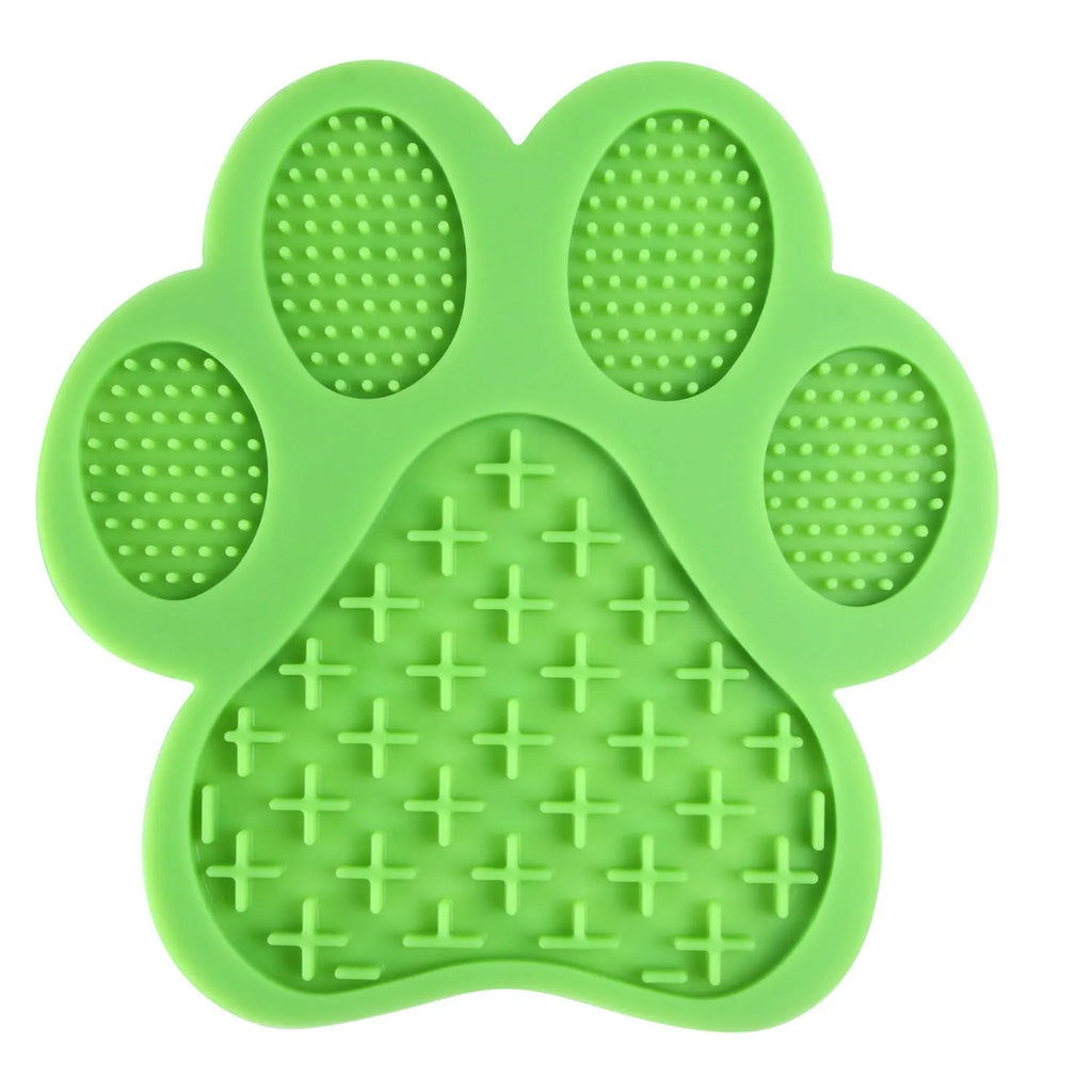 Paw-shaped silicone dog lick pad, 18cm x 18cm, food-grade BPA-free, shown in red with soft food spread on top