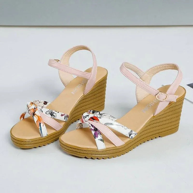 Pink women's wedge sandals with a fish mouth open toe and a thick non-slip heel.