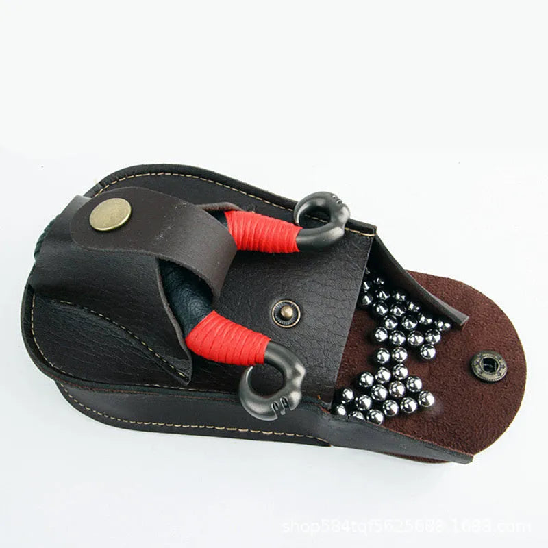 Leather slingshot belt bag in black, holding steel balls, attached to a belt for outdoor carry.