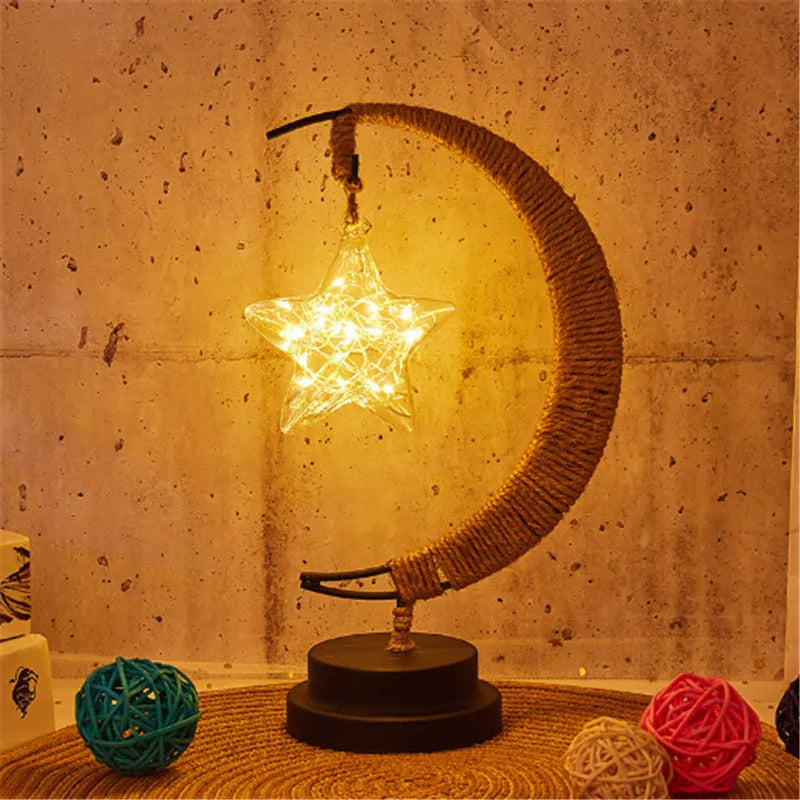 LED modelling lights with star, moon, apple, and round ball shaped covers on a warm white Christmas decoration display
