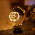LED modelling lights with star, moon, apple, and round ball shaped covers on a warm white Christmas decoration display