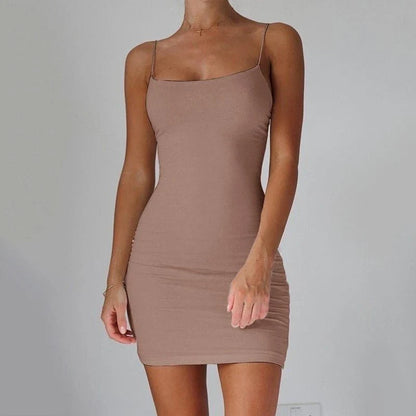 Stylish spaghetti strap mini dress in various colors, featuring a figure-hugging fit and contemporary design