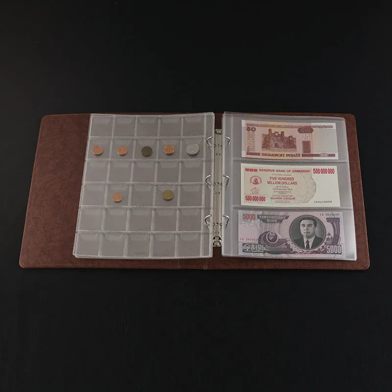Transparent loose-leaf PVC stamp and coin collection album open showing clear storage pages