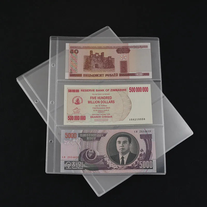 Transparent loose-leaf PVC stamp and coin collection album open showing clear storage pages