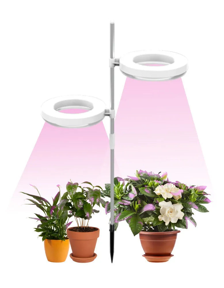 Compact white PC shell plant growth lamp with LED lights, shown on a wooden desk.