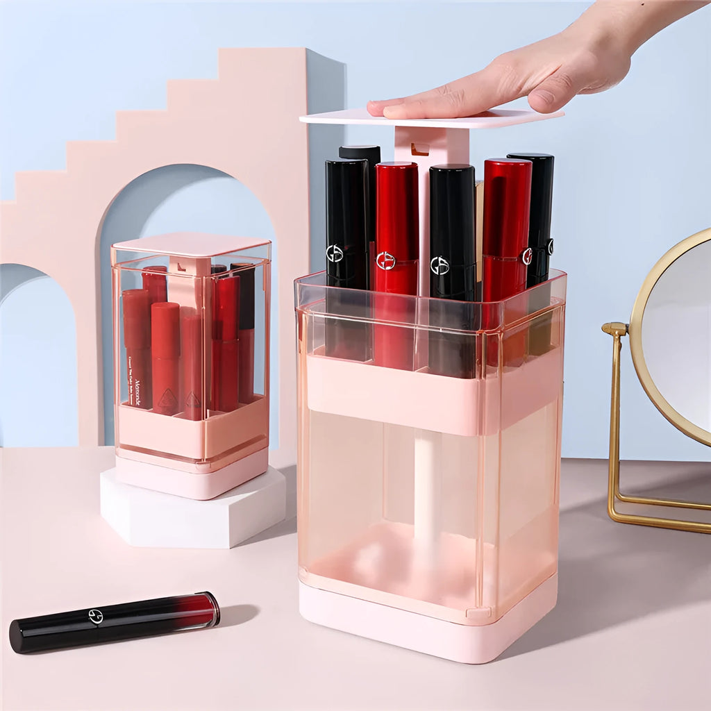 Press-to-lift lipstick storage box in pink or white on a desktop, showing 8-grid or 12-grid configuration.