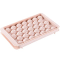 Sky blue and pink plastic round ice ball mould trays with 18 and 33 grids.