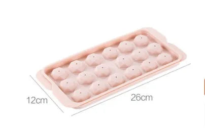 Sky blue and pink plastic round ice ball mould trays with 18 and 33 grids.