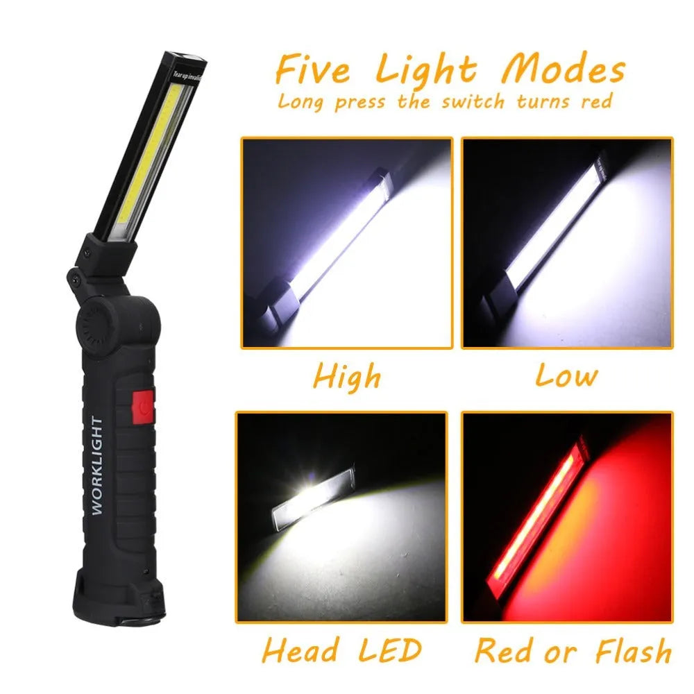 COB LED tactical flashlight in carbon-black finish with folding stand, magnet, and hanging hook on a metal surface