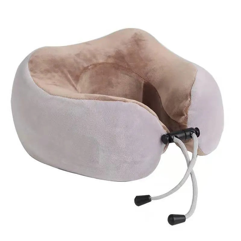 Brown U-shaped electric neck massage pillow on a grey background.