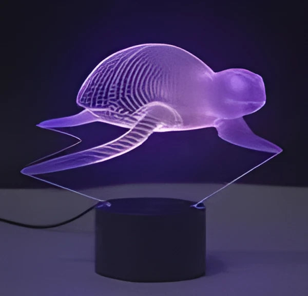 Compact colourful 3D LED table lamp with acrylic panel on a black ABS base, showing gradient light effects.