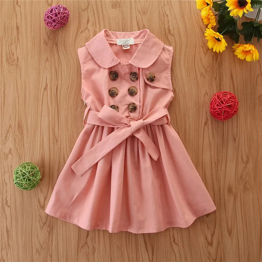 Girls sleeveless pink cotton princess A-line dress with a sash and button detail on a hanger.
