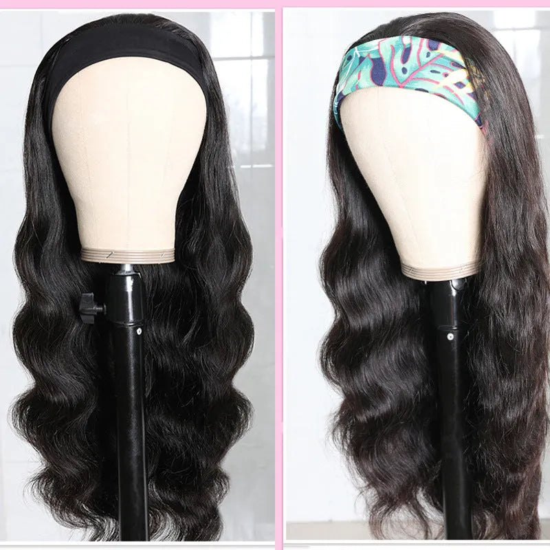 Long curly black synthetic wig with big wave and centred bangs on a head model