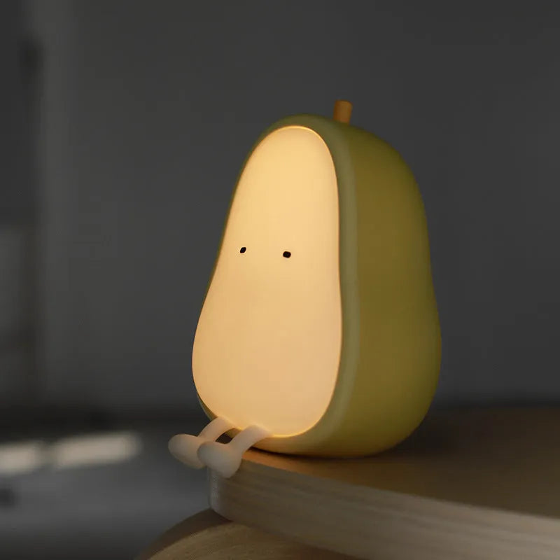 Silicone pear-shaped night lamp in warm yellow colour with compact dimensions