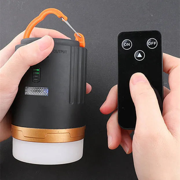 Black remote control emergency camping light with LED illumination and a separate wireless remote.