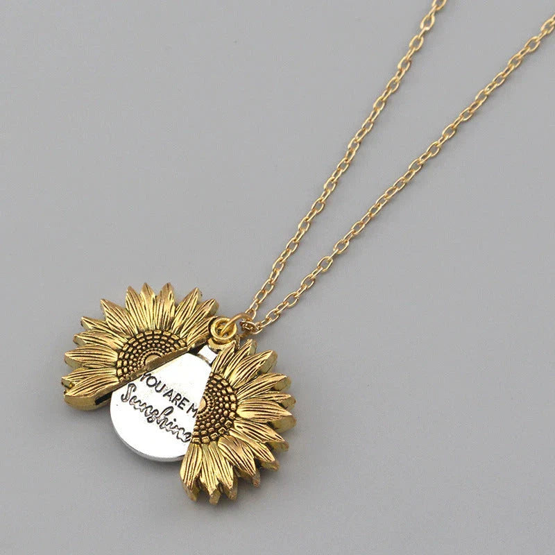 A stunning sunflower pendant necklace with an adjustable chain in various fashionable colors