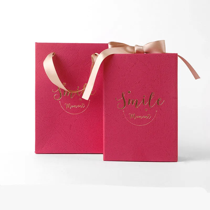 Small cardboard gift box set with matching handbag and raffia in blue, pink, red, or white.