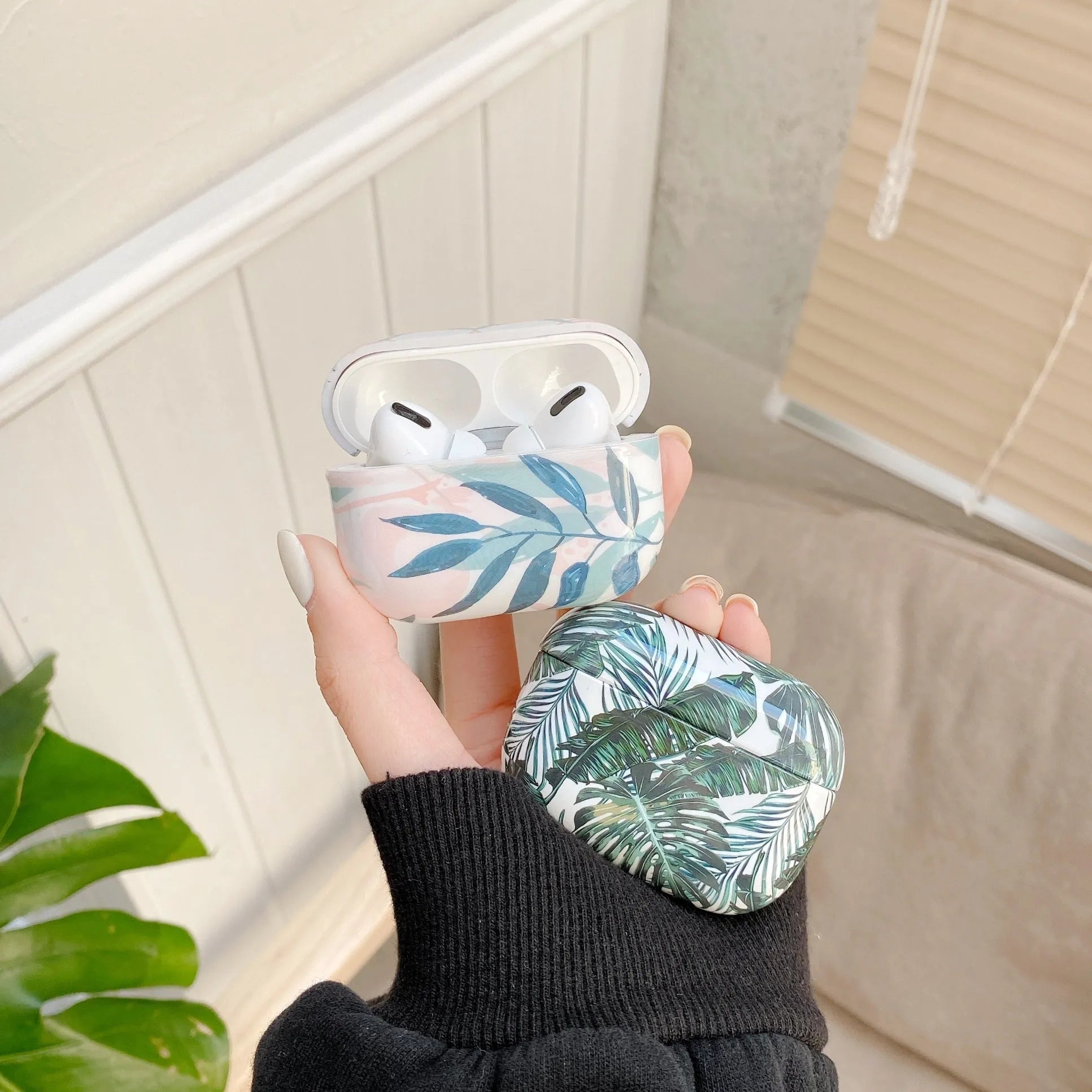 Blue and green banana leaves patterned TPU case for Apple AirPods 1, 2, and Pro models
