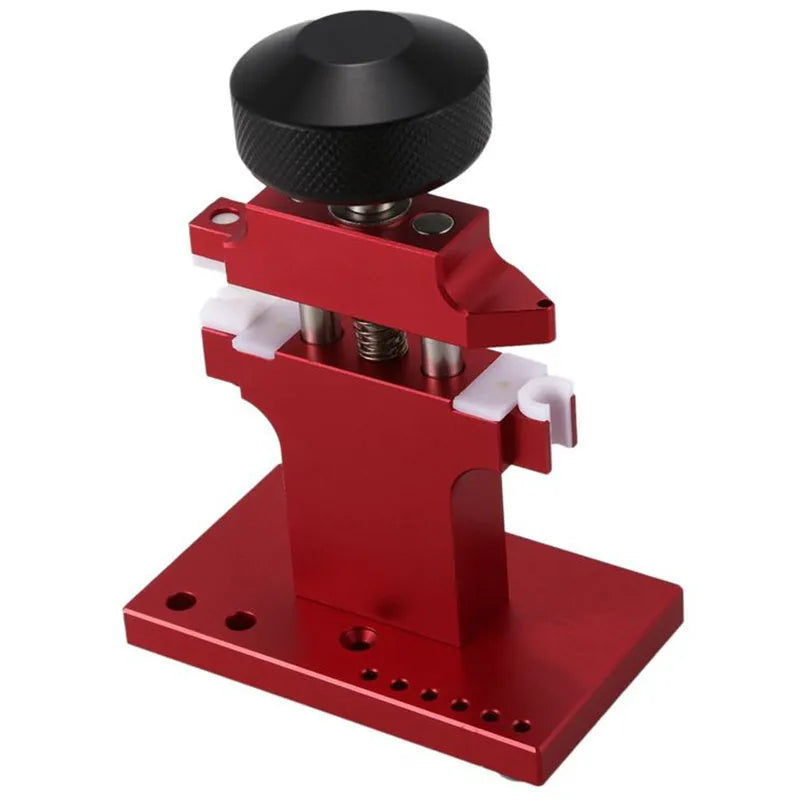 Red metal watch tube machine with 7 pusher punch bits in a stand
