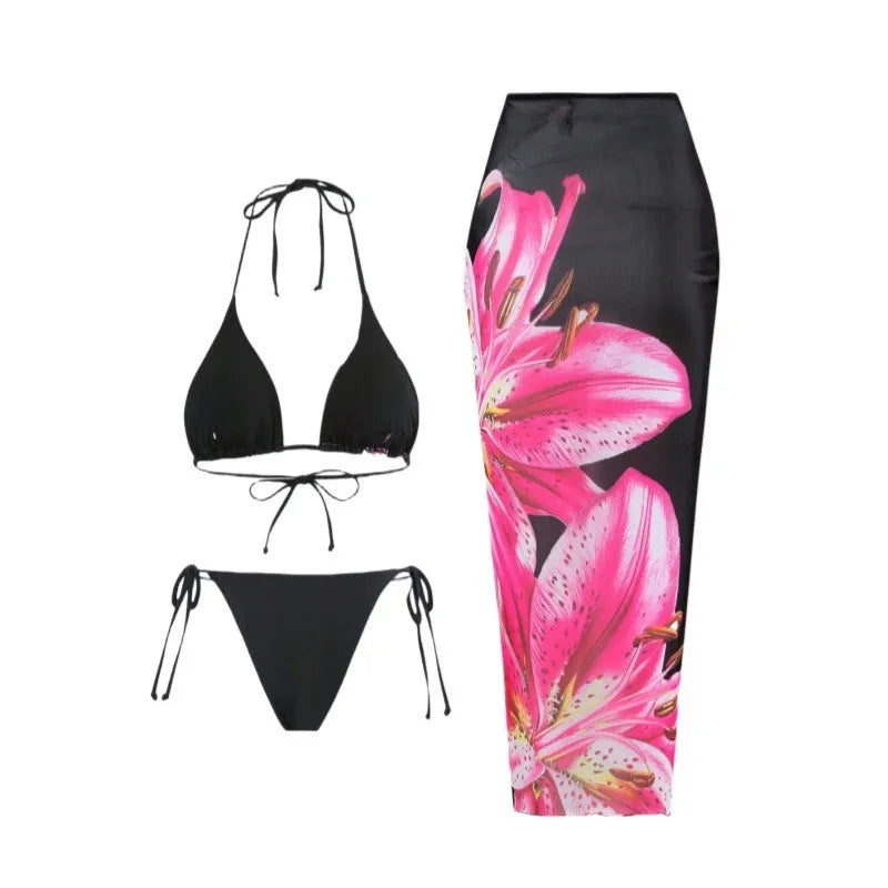 Women's printed bikini three-piece set with black red flowers and matching wrap skirt in polyester