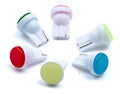Close-up of a small T10 automotive LED bulb showing its 3D COB light source and compact rectangular shape.