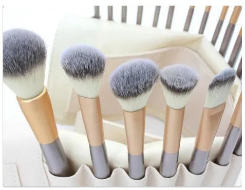 Persian makeup brush set with rice white bristles and champagne handles, showing multiple brushes.