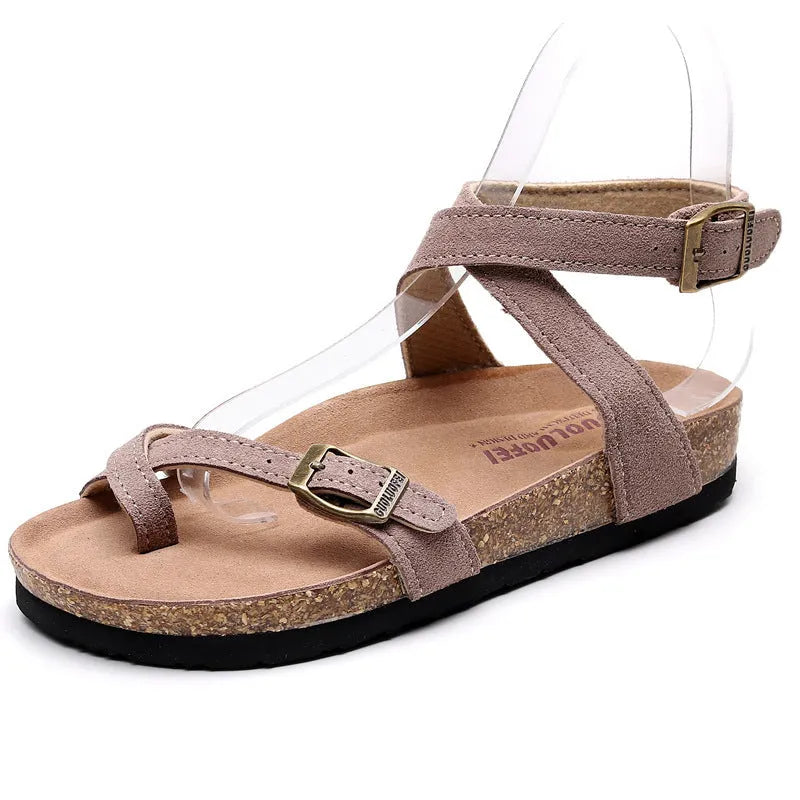 Women's cow suede toe covering slippers with buckle closure, brown colour, low heel 1-3cm, round toe, flat heel on plain background