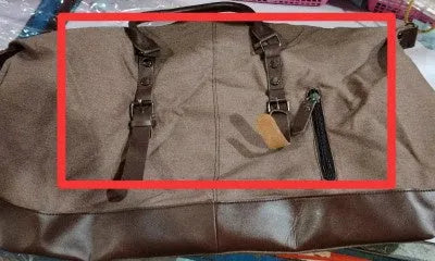 Canvas travel bag for men, square vertical shape in light grey, with shoulder strap and zipper closure