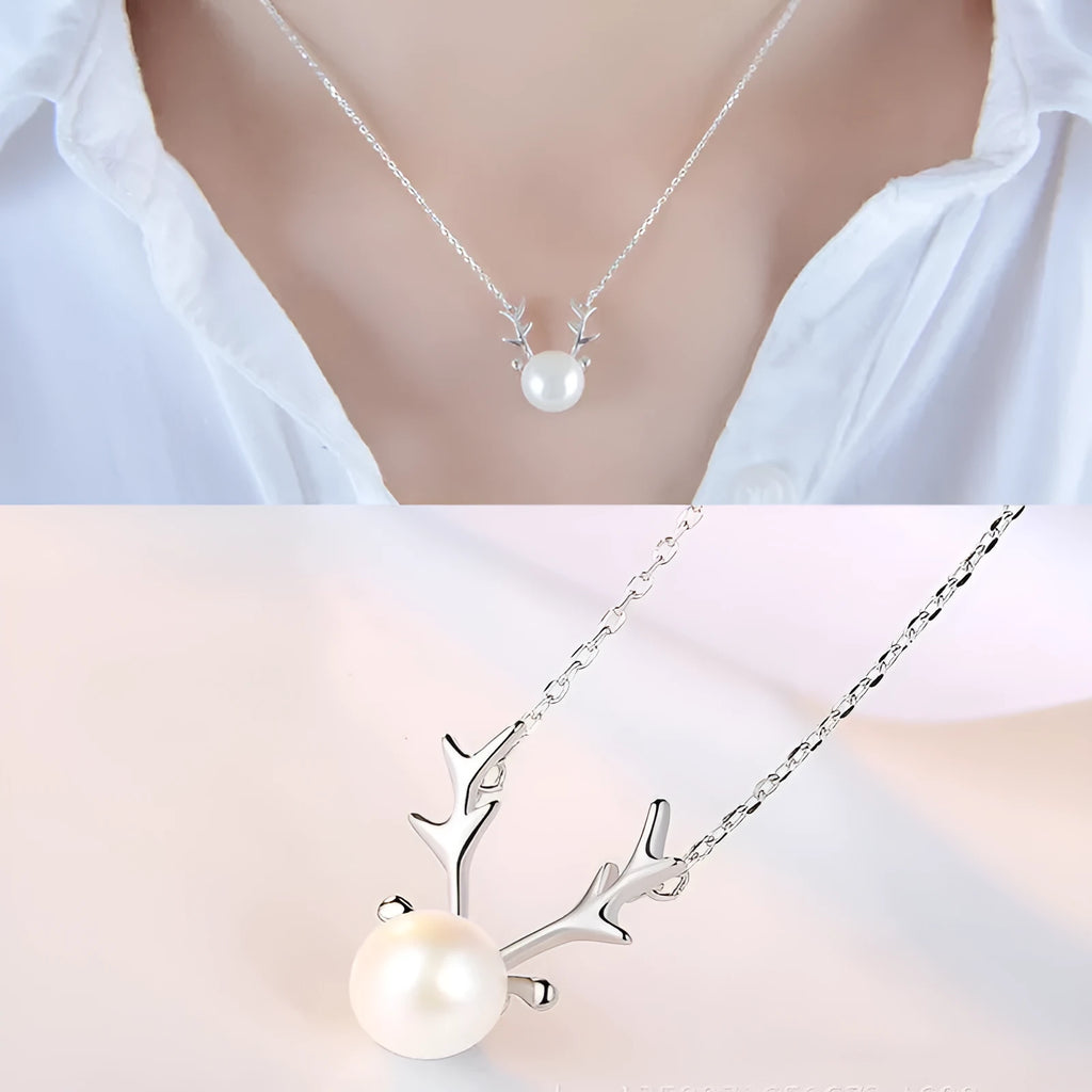 Small elk pearl pendant in copper with gold finish, front view against white background