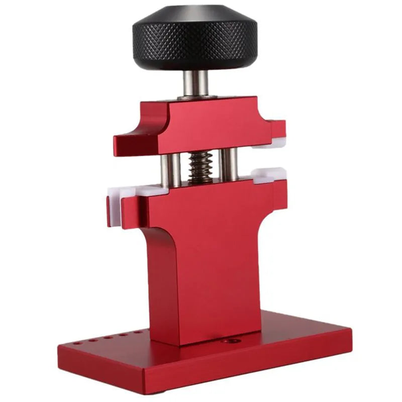 Red metal watch tube machine with 7 pusher punch bits in a stand