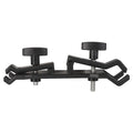 Black ABS umbrella clip attached to camera tripod shaft with umbrella in mounting position