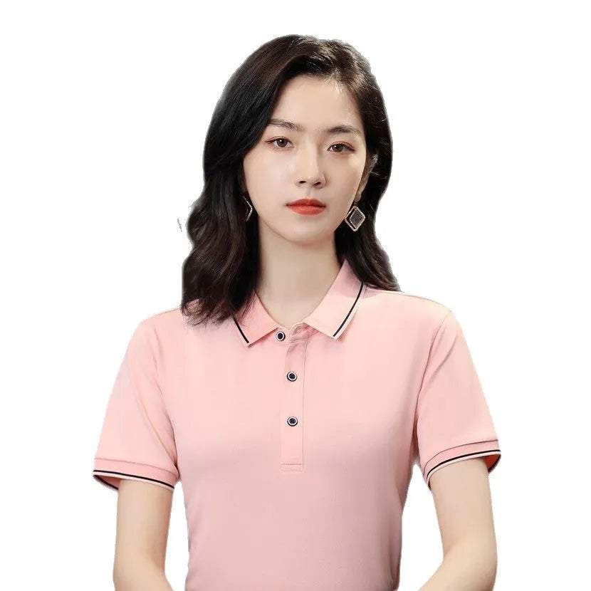 Short-sleeved asymmetric polo shirt for beauticians in pea green, shown on a hanger.