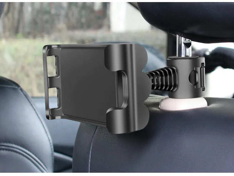 Black universal car headrest holder mounting a tablet for rear seat passenger use