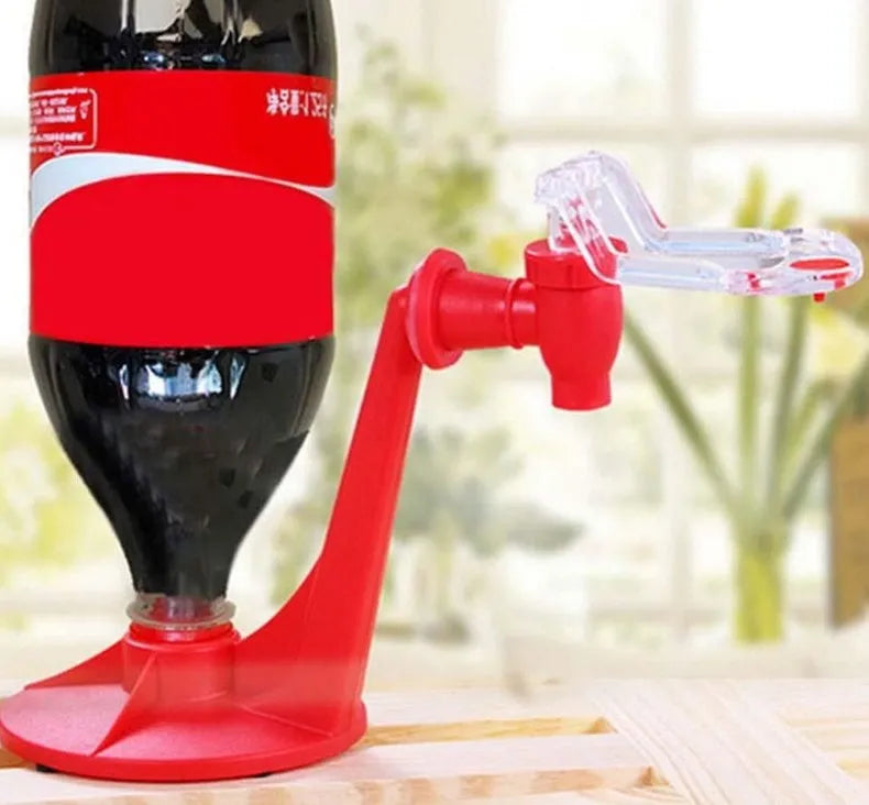 Red plastic Magic Tap soda dispenser attached to inverted 2-litre bottle for push-button drink serving